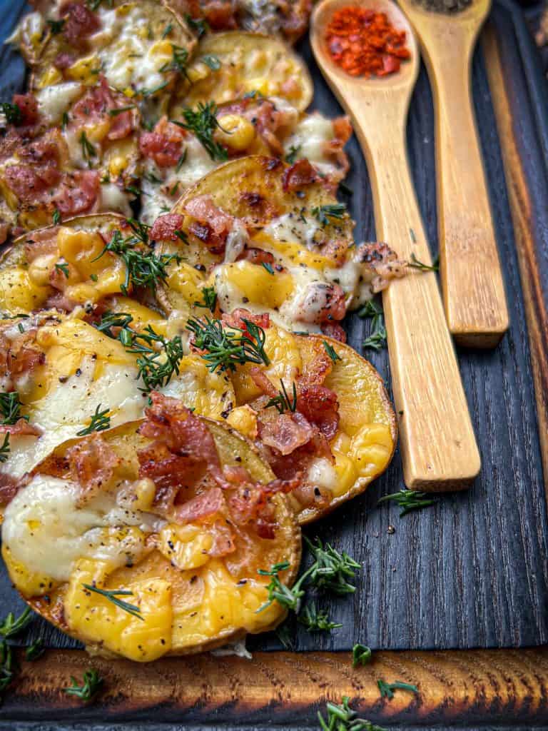 Slices of grilled potatoes loaded with bacon and cheese