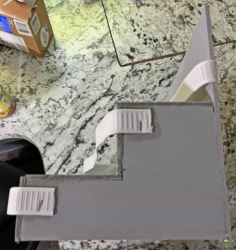 side view of a homemade tiered shelf for an RV