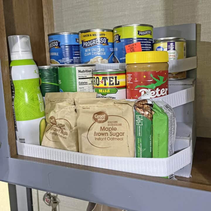 tiered storage shelf for an RV with food on it