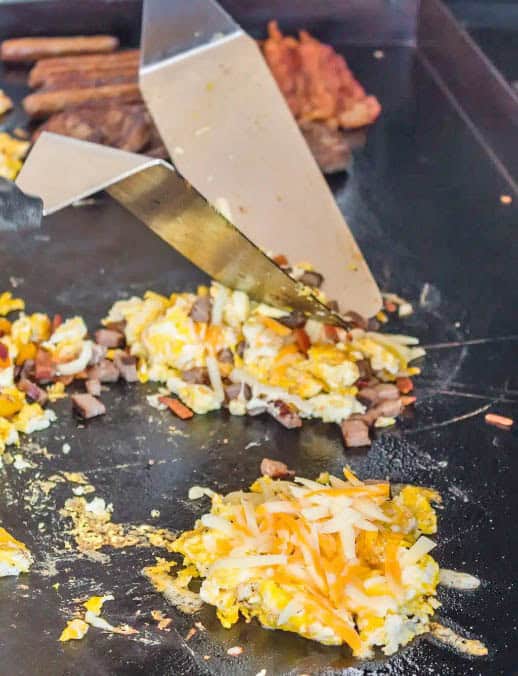 eggs and meat with cheese on the Blackstone Griddle