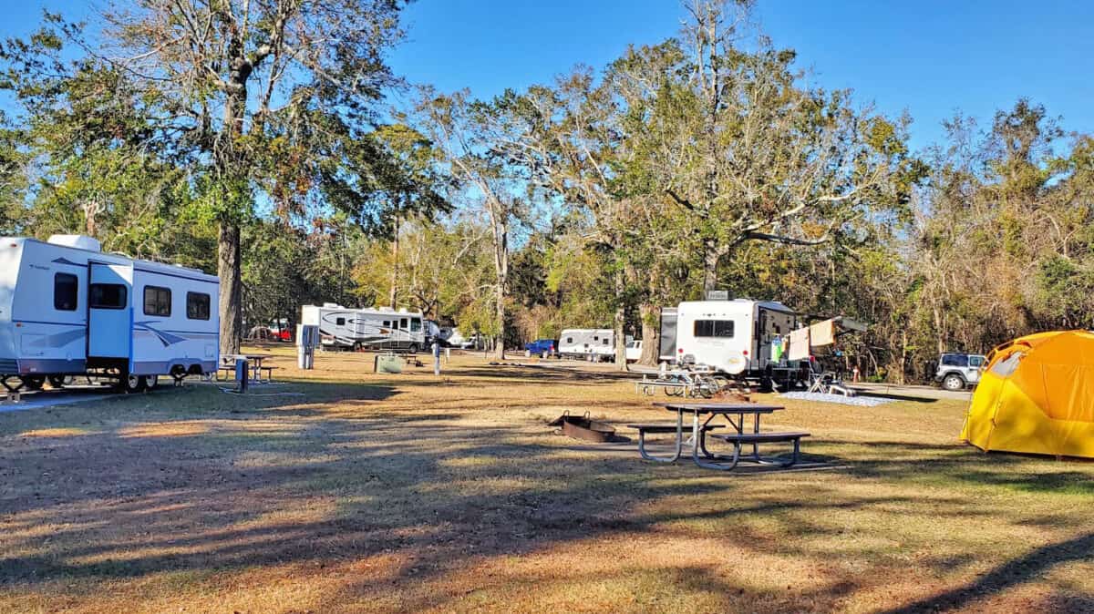 Campers and a tent set up in a state park in Illinois