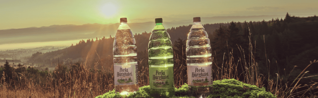 Perla Harghitei mineral water bottle banner from Romania showing natural still and sparkling water from Harghita region