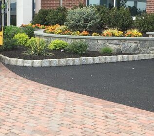 Asphalt & Masonry Stone and asphalt driveway