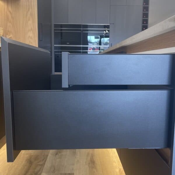 Kitchen Cabinet Materials for your Kitchen Design 23 Open dark grey kitchen drawer with a smaller inner drawer nested inside