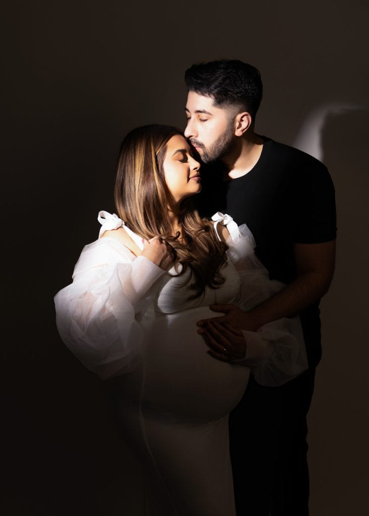 Edmonton maternity photography, husband hold wife