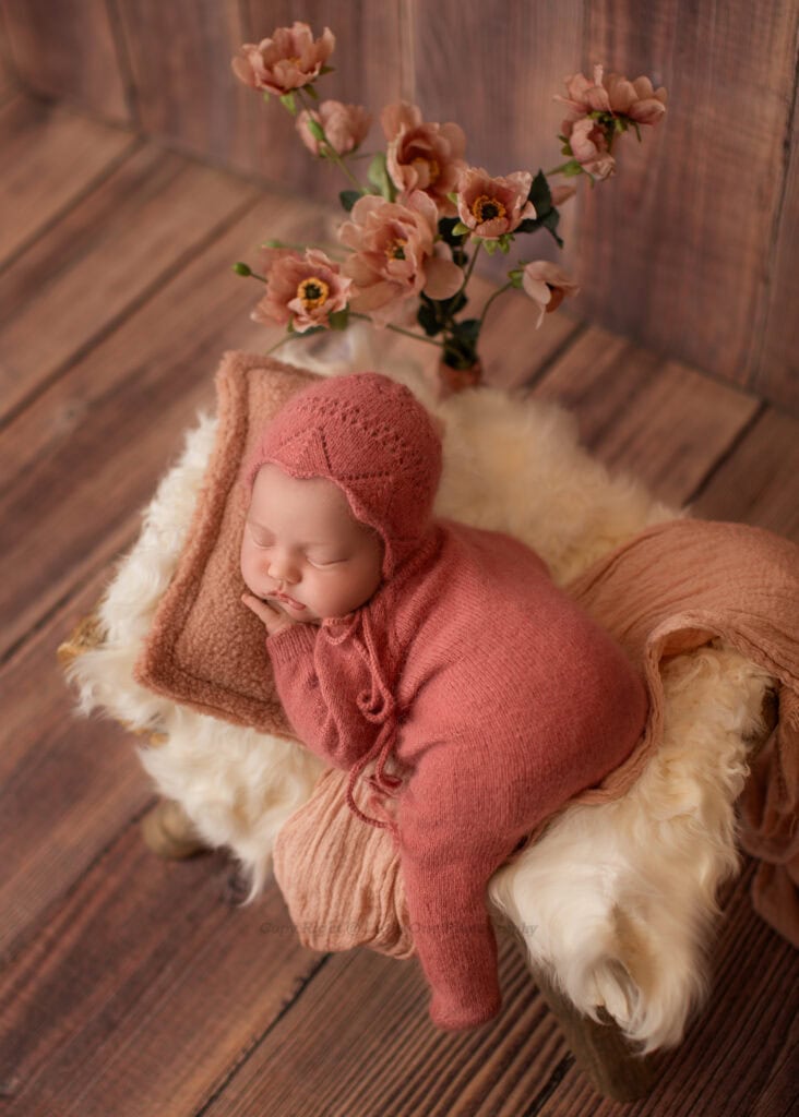 Studio newborn portrait of a sleeping baby in soft neutral tones