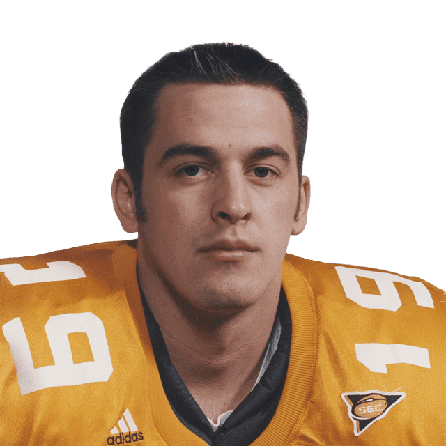 Football player in yellow jersey with Lou Groza Award logo, focused expression.