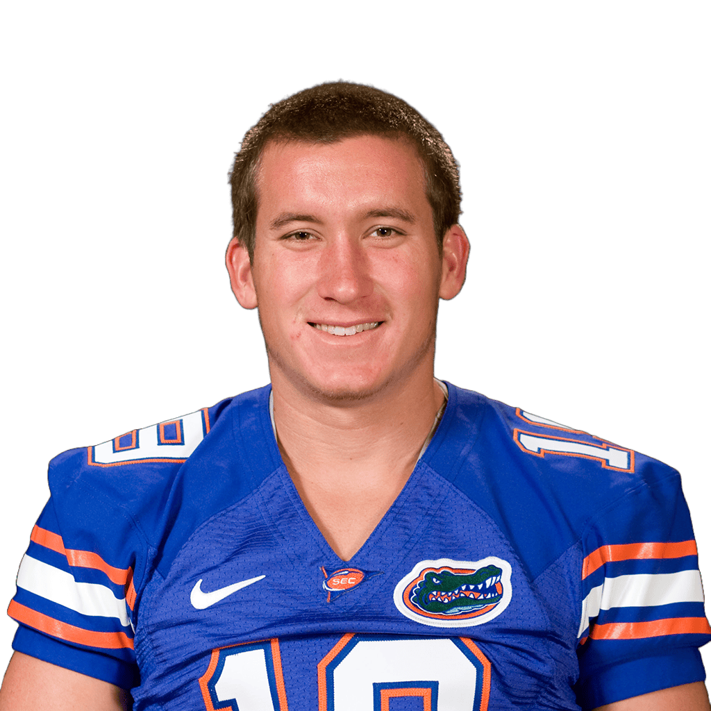 Young male football player in blue Florida Gators jersey smiling for the camera.