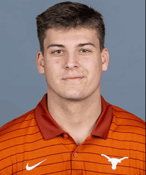 Young male football player in orange Texas Longhorns jersey.