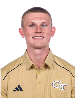 Young man in Georgia Tech shirt smiling for the camera.