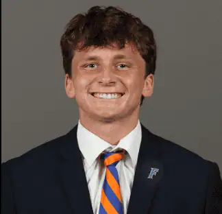Young man in suit smiling, representing Lou Groza Award nominee.