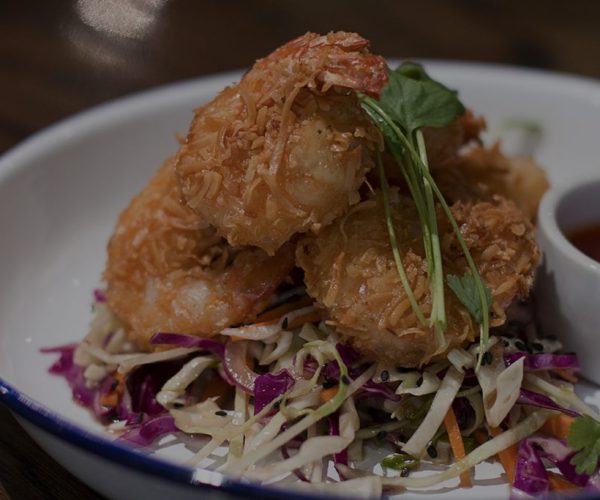 Crispy prawn spring rolls with vibrant Asian slaw and dipping sauce at Lush Cafe, Centre City.