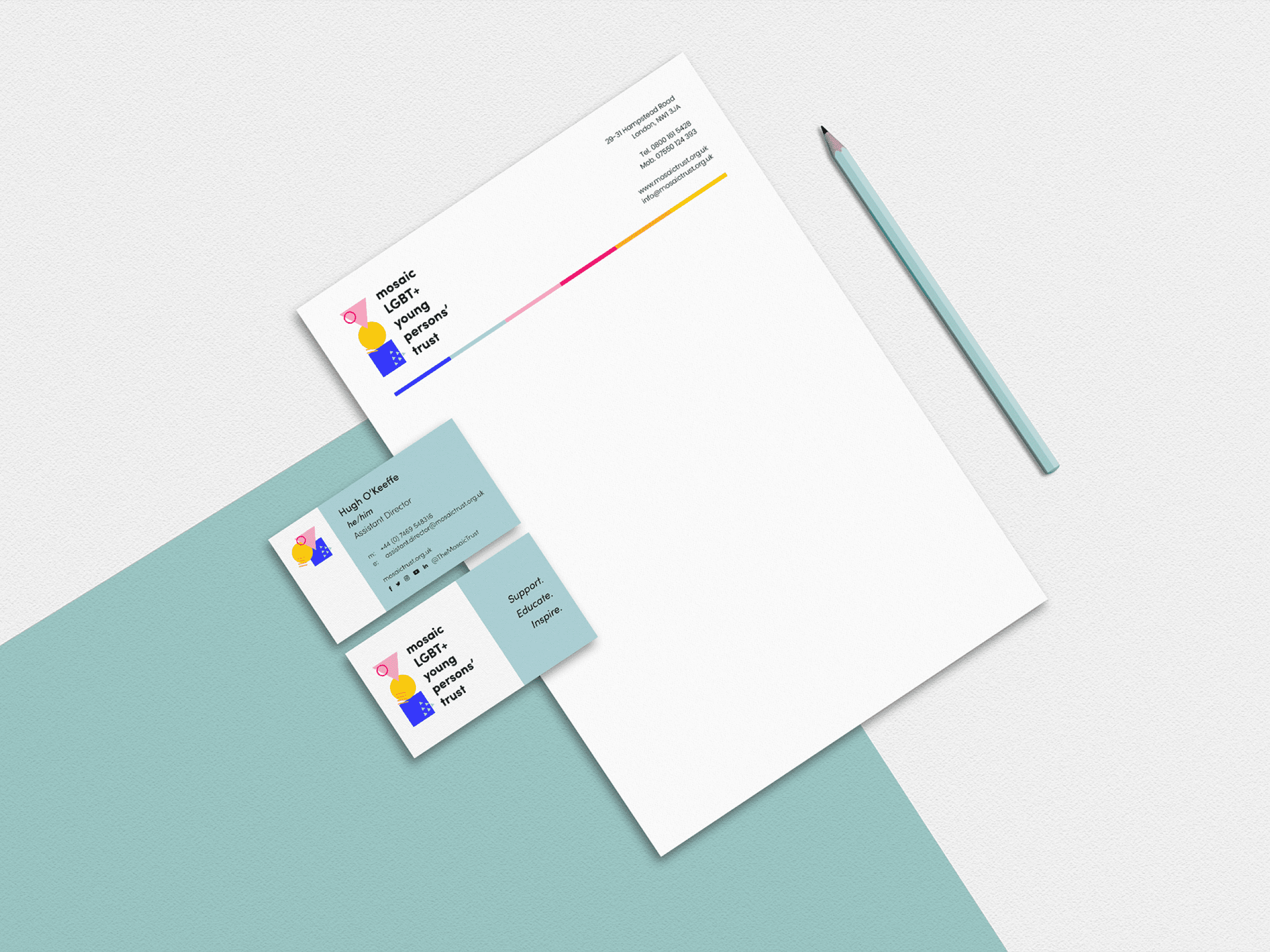 A letterhead and two business cards sit on a turquoise background. They showcase a geometric logo and contact details. A light blue pencil is positioned next to them. The design includes a striking gradient line.