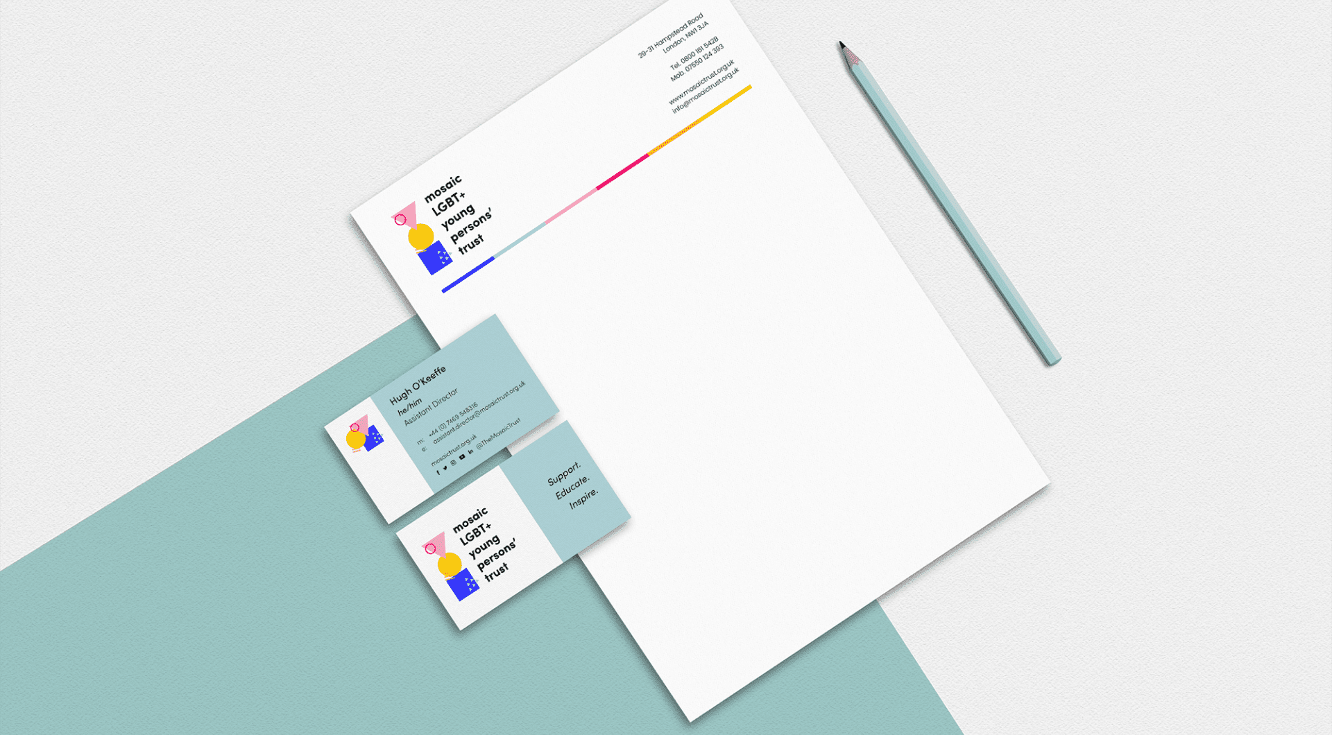 A minimalist stationery set displaying a letterhead with colourful lines, contact information, and straightforward graphics, paired with matching business cards. A pencil rests beside the letterhead on a light blue background.