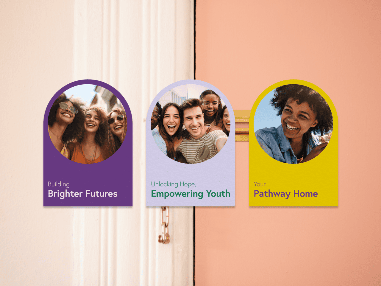 Three colourful cards with happy young people and phrases: Building Brighter Futures, Unlocking Hope, Empowering Youth, above a door lock.