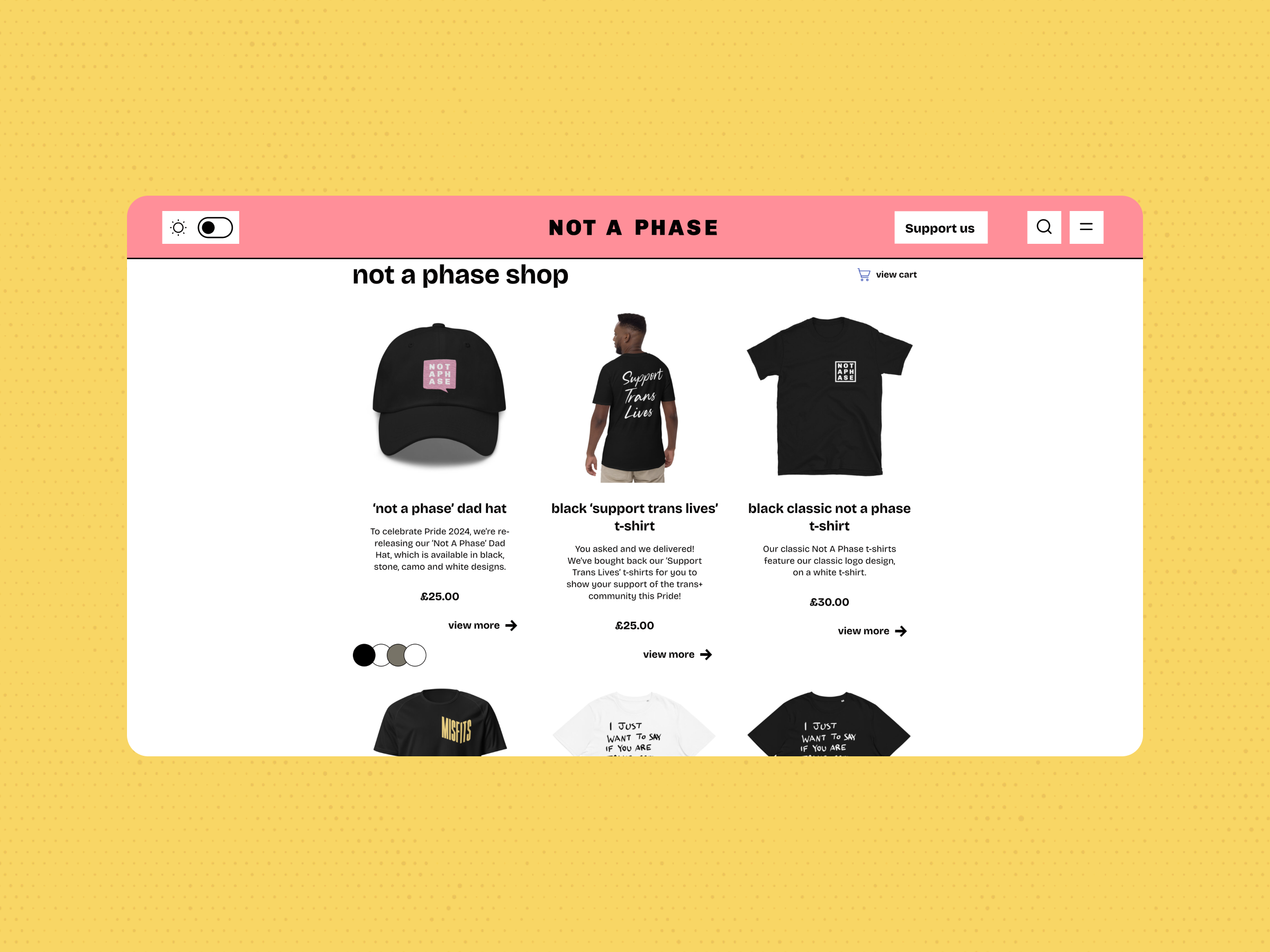 Screenshot of the Not a Phase online shop displaying a black cap and two black T-shirts with text designs for sale. The webpage features a pink header atop a lively yellow background.