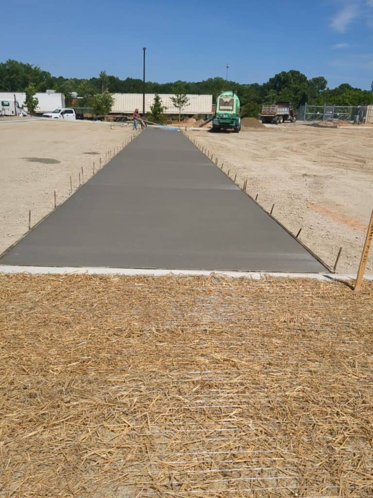 Concrete improvements and site work during Ross Dress for Less parking lot construction Decatur GA