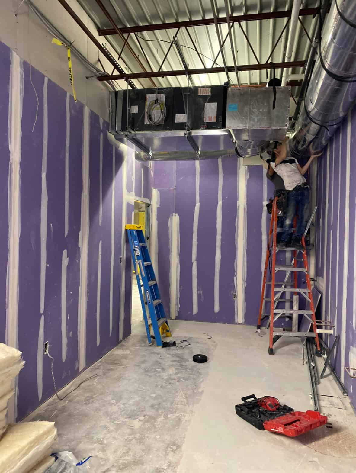 Tropical Smoothie Cafe Covington GA — drywall hanging in dining area during restaurant build-out by Modern Day Commodities