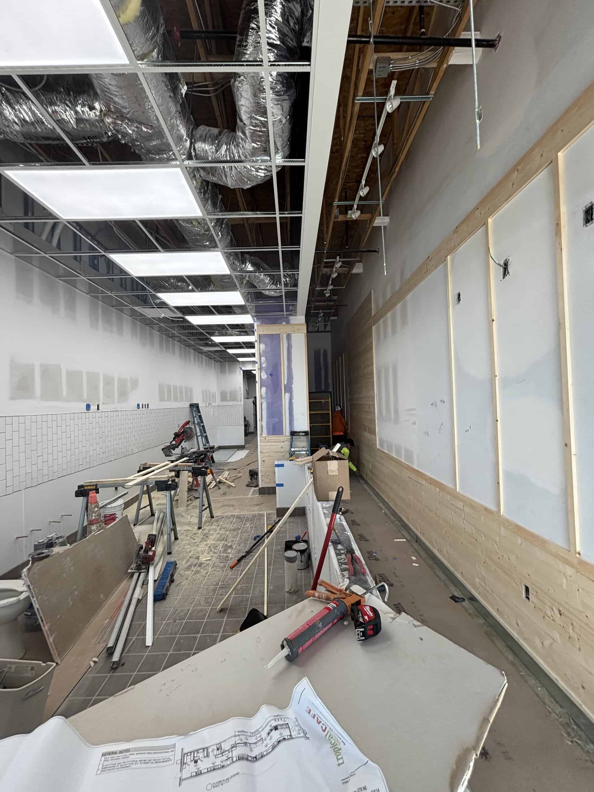 Tropical Smoothie Cafe Covington GA — acoustical ceiling grid installation during restaurant build-out by Modern Day Commodities