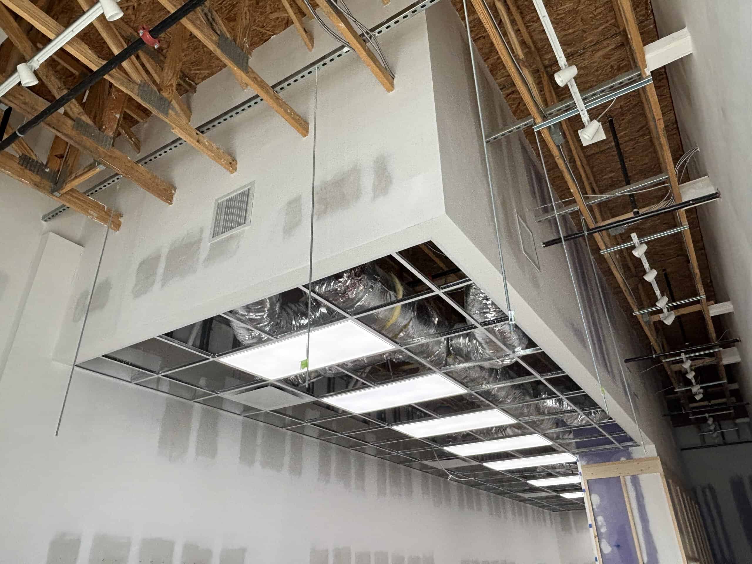 Tropical Smoothie Cafe Covington GA — ceiling tile installation during restaurant build-out by Modern Day Commodities