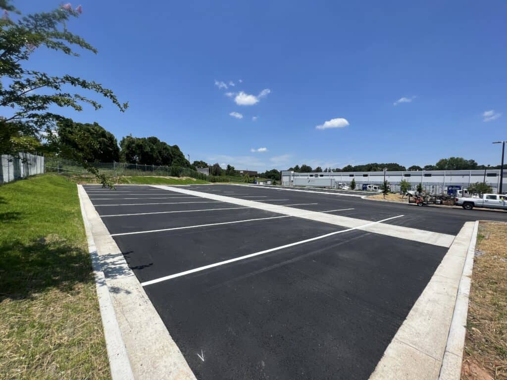 Parking lot grading and base work during Ross Dress for Less sitework project Decatur GA