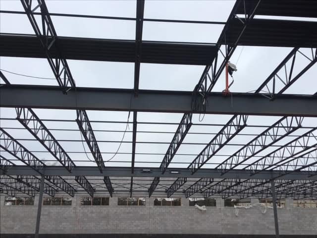 Lidl supermarket Decatur GA — structural steel bar joist erection during ground-up commercial construction by Modern Day Commodities