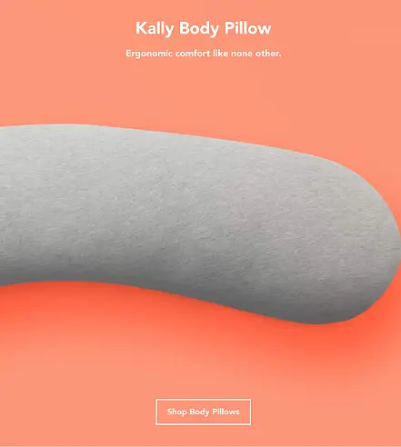 The bottle is positioned diagonally and appears to be balanced on a large, reflective, circular object . The scene is illuminated by warm, orange/amber light, and a fine mist of spray is visible near the top of the bottle.