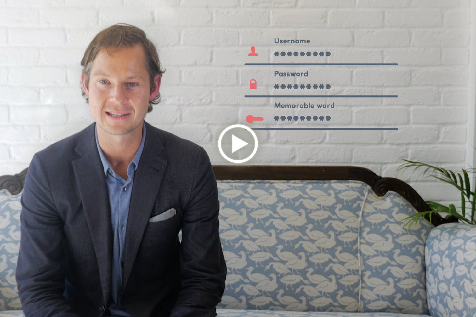 A person wearing a VR headset in a dark room lit with red and blue lights, smiling and reaching forward as if interacting with virtual objects.
