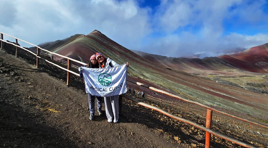 Tourists at Rainbow Mountain in Cusco, Peru with scenic mountain views.