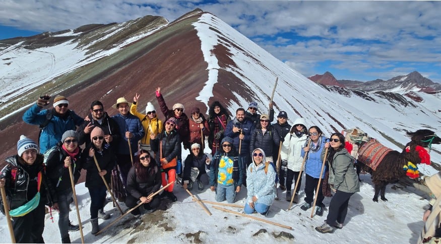 Visitors wearing thermal layers at Rainbow Mountain Peru