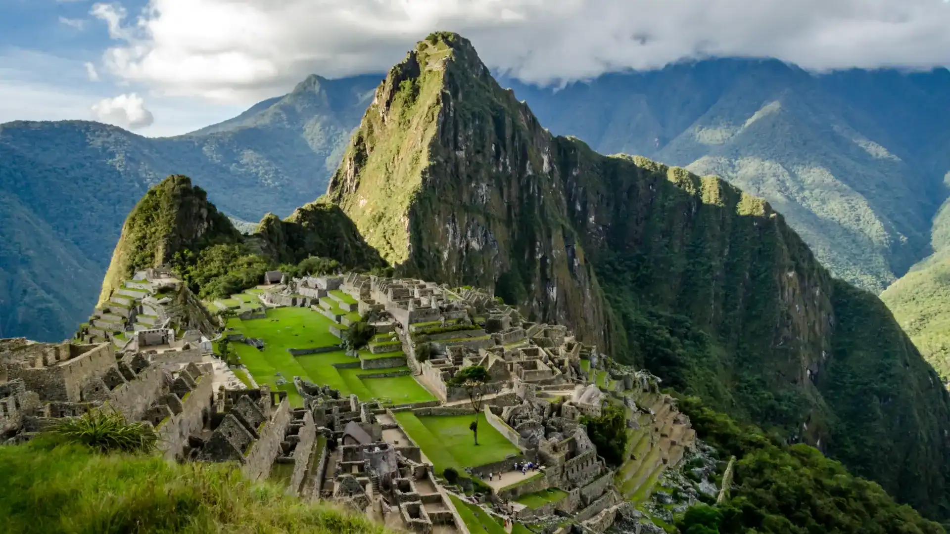 Iconic Machu Picchu ruins with lush green mountains in Cusco, Peru.
