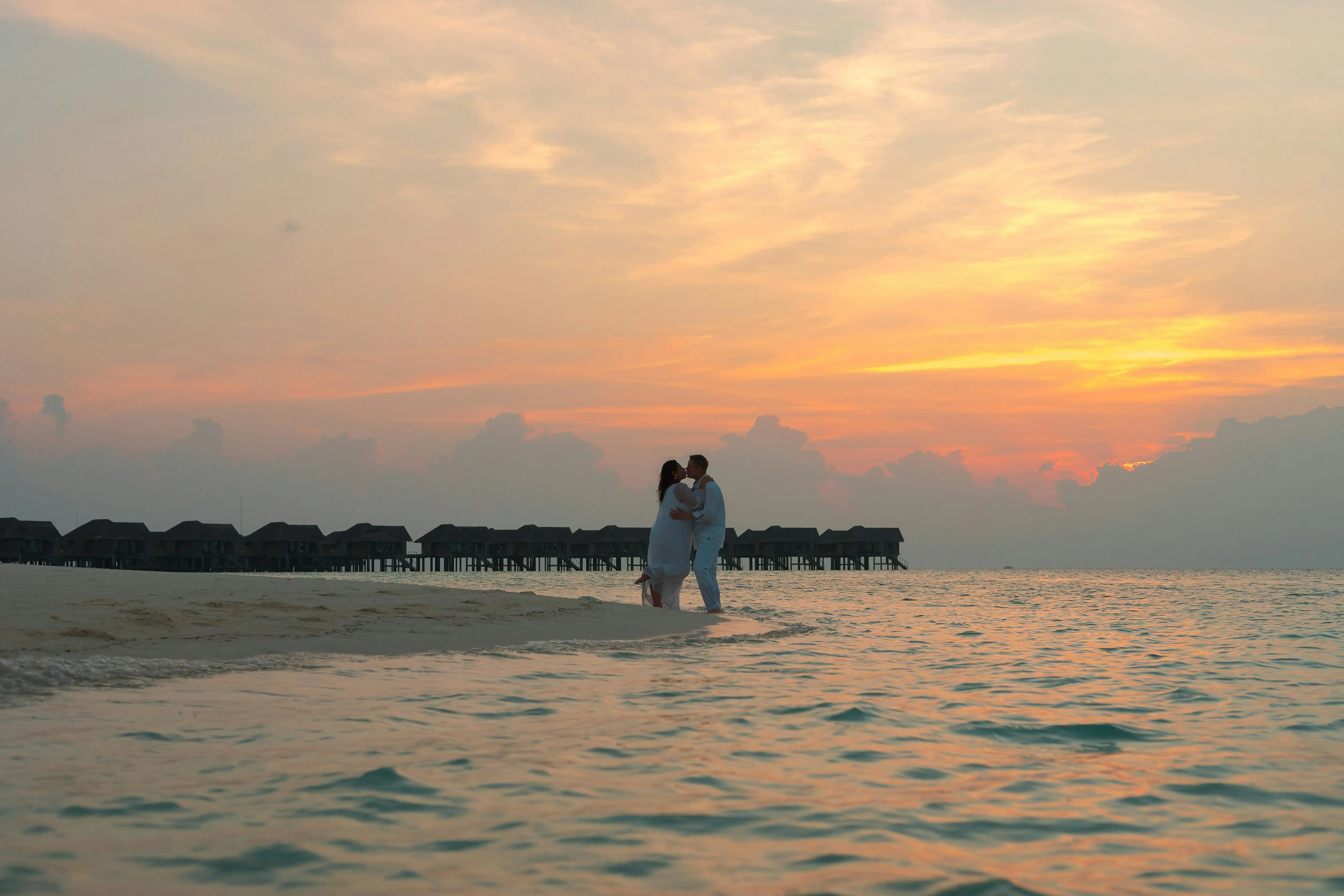 Aerial shot of a couple near a sea