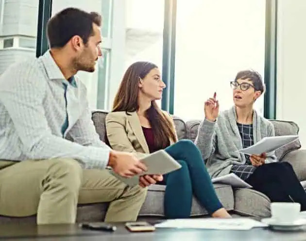 Three people in a meeting