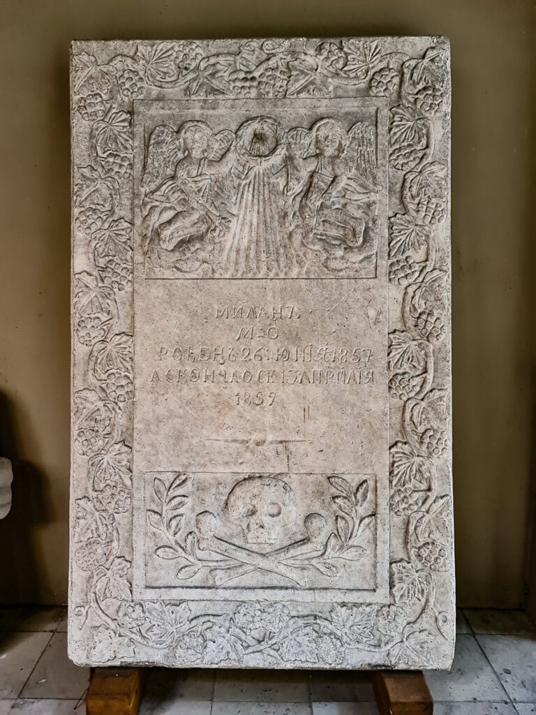A tombstone in Stavropoleos Monastery's courtyard