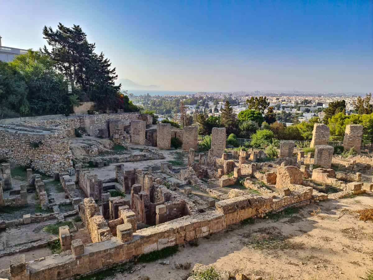 Ancient ruins of Carthage with panoramic view of Tunis in the background, one of the most important archaeological places to visit in Tunisia.