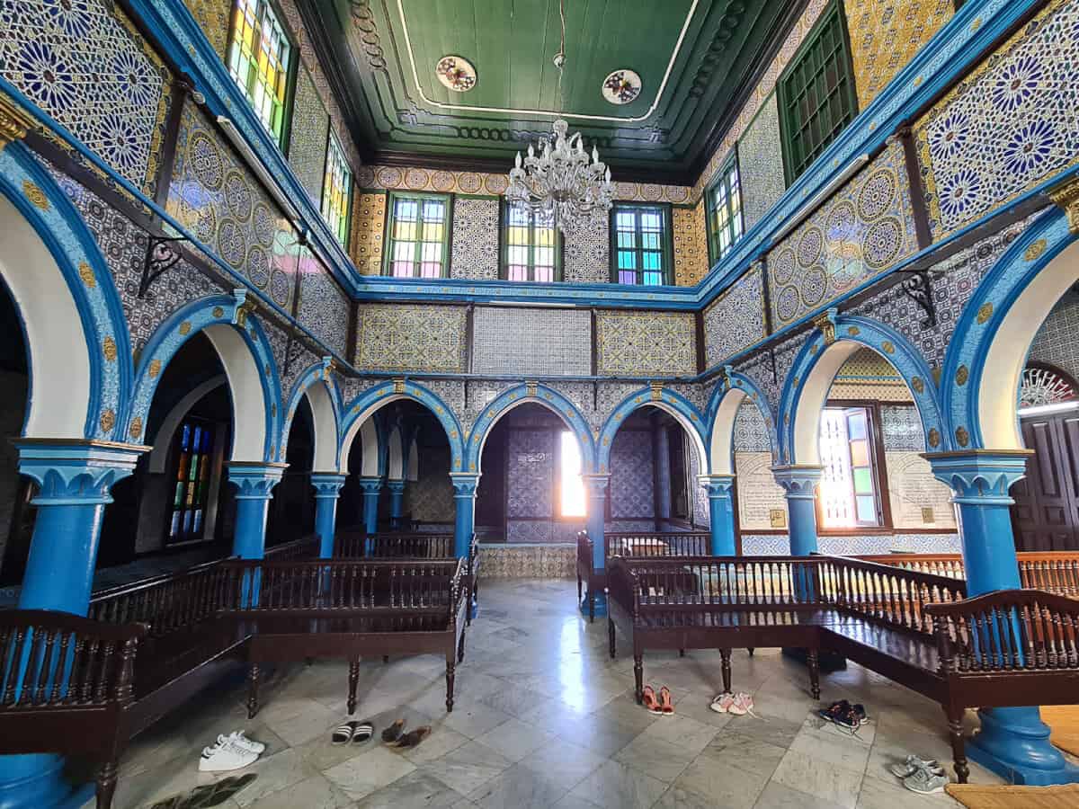 Colorful tiles and arched architecture inside El Ghriba Synagogue on Djerba Island, one of the oldest synagogues in Africa and a unique cultural site in Tunisia.