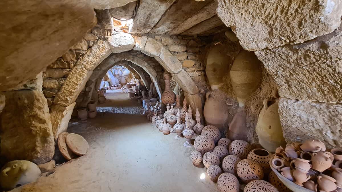 Tunnel-like interior of a traditional pottery workshop in Guellala, Djerba Island – a top place to explore Tunisian craftsmanship and buy authentic ceramics.