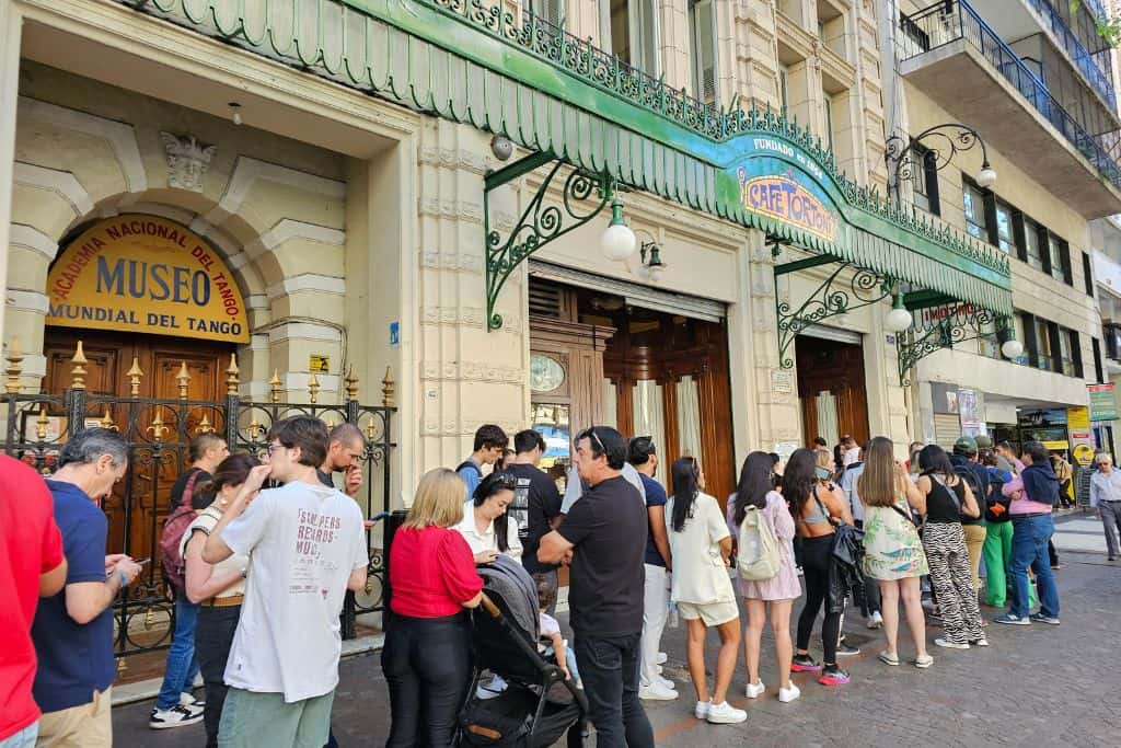 The long line waiting to be seated in Cafe Tortoni. Visiting the historic cafe is one of tourists' favourite things to do in Buenos Aires.