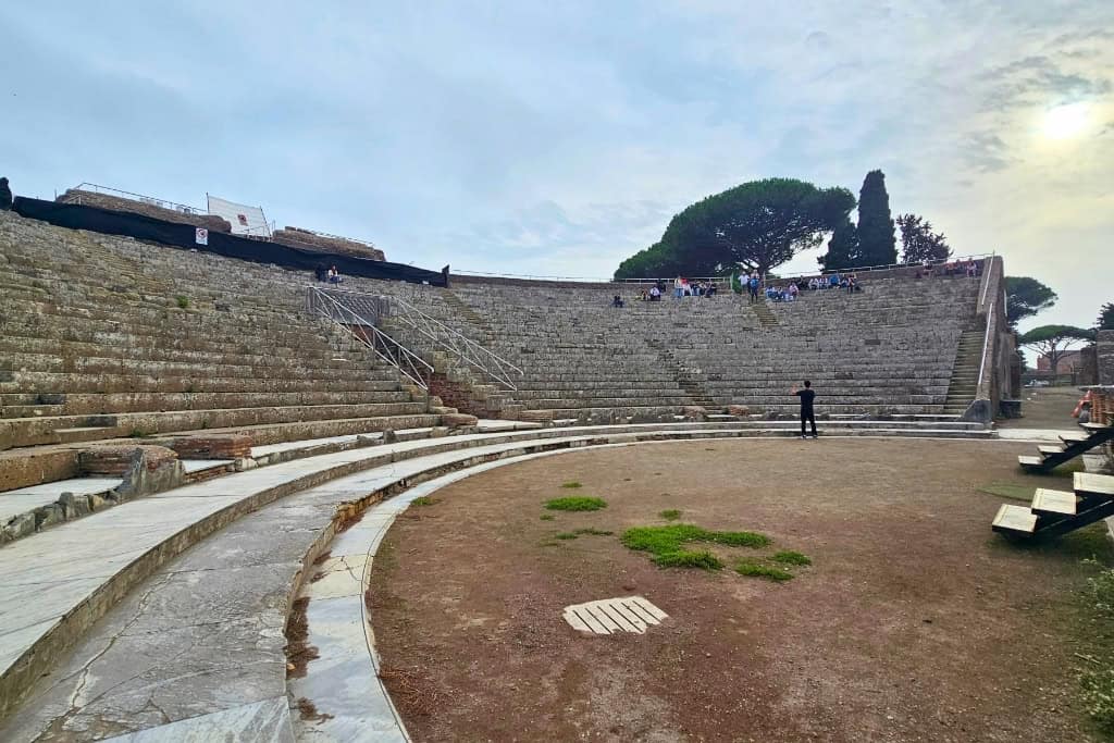 View from the stage of Ostia Antica amphitheater, showcasing the Roman architectural grandeur.