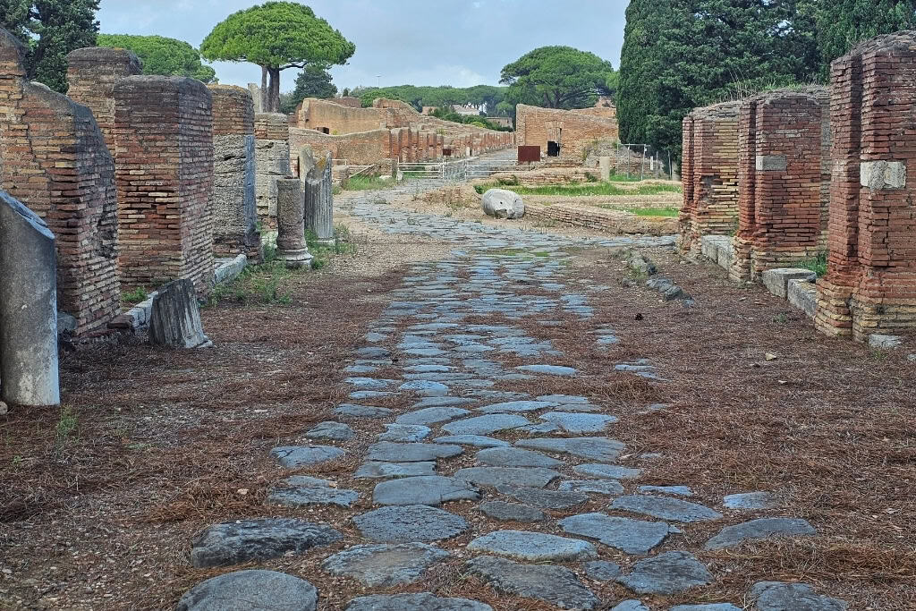 Ancient Roman road at Ostia Antica, a must-see when visiting Ostia Antica ruins.