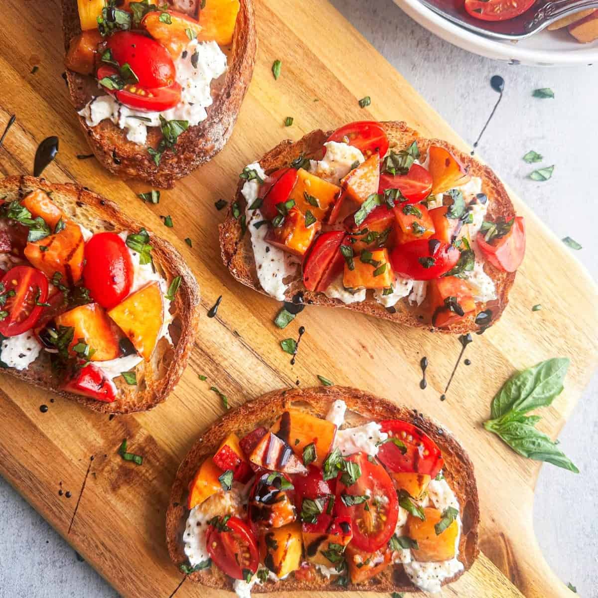 Burrata bruschetta with peaches and tomatoes.