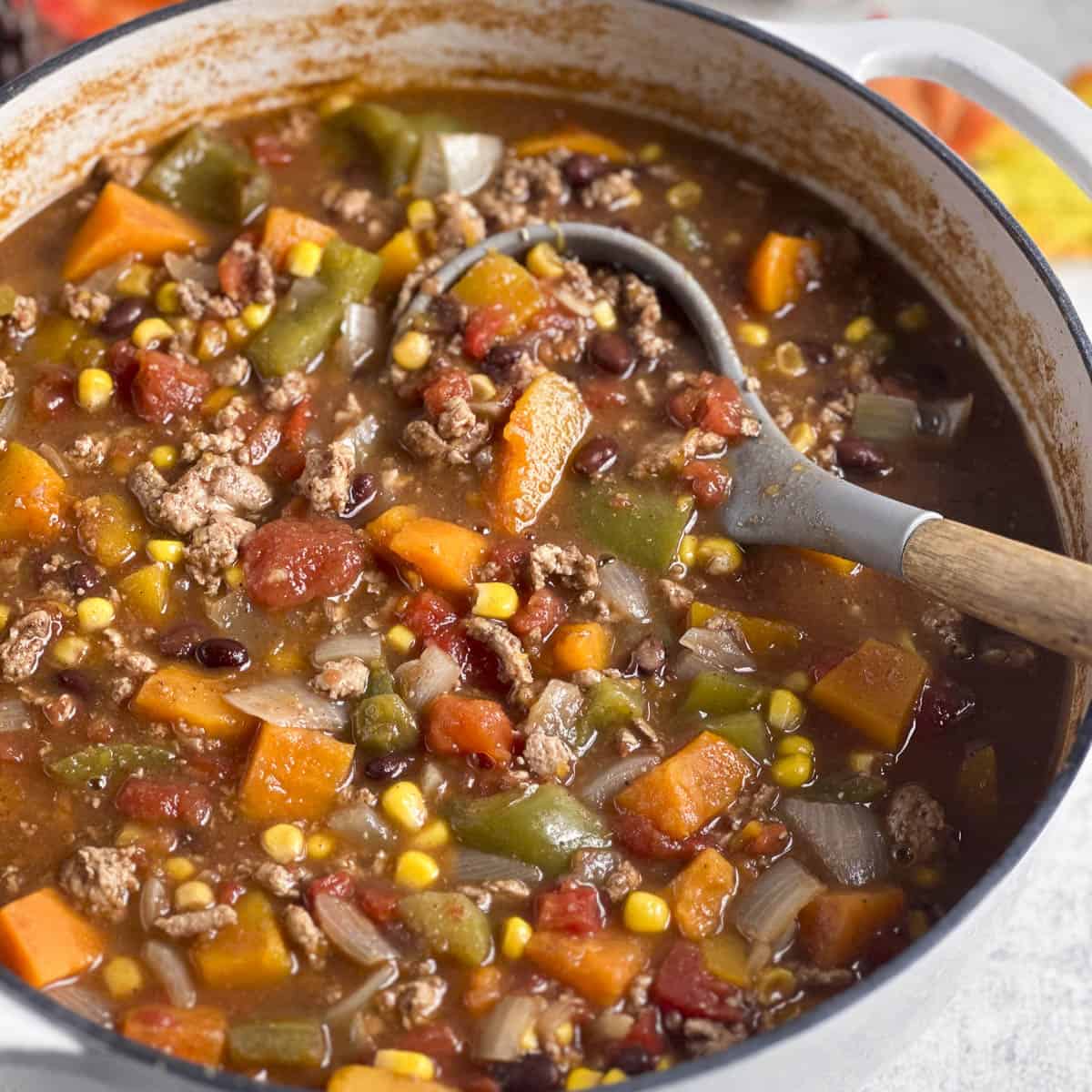 Fall harvest chili with a serving spoon.
