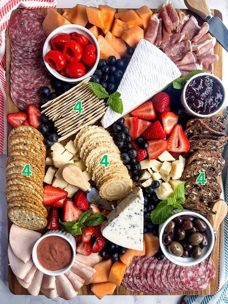 Charcuterie board with step number 4 labels for placement of crackers.