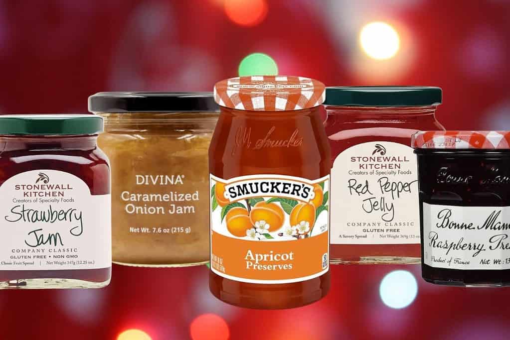 Jars of jams, preserves, and spreads on a red background.