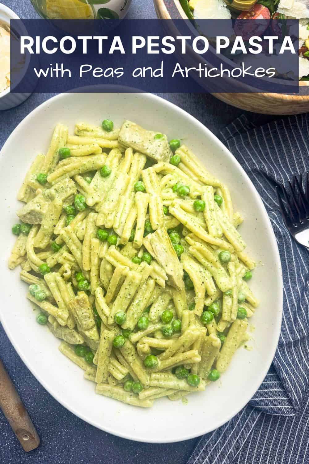 Ricotta pesto pasta on an oval serving plate.