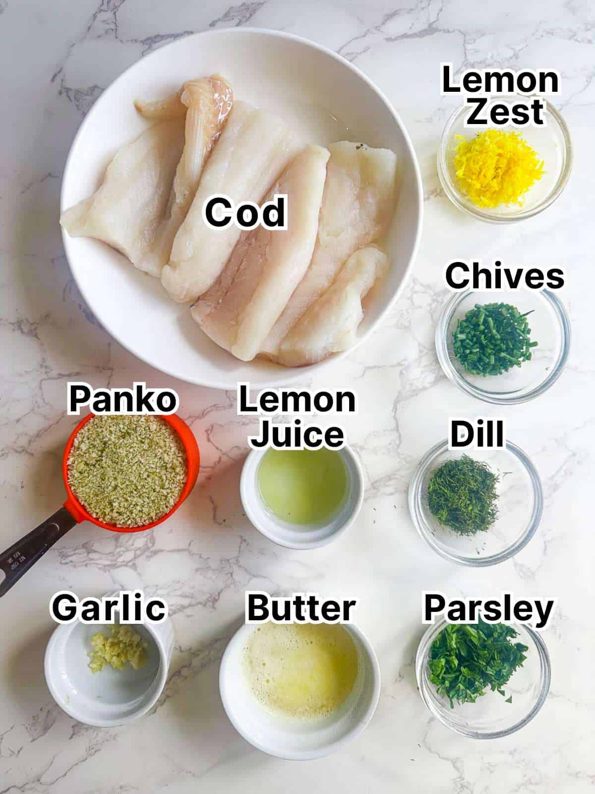Ingredients laid out on a marble counter for herb crusted cod.