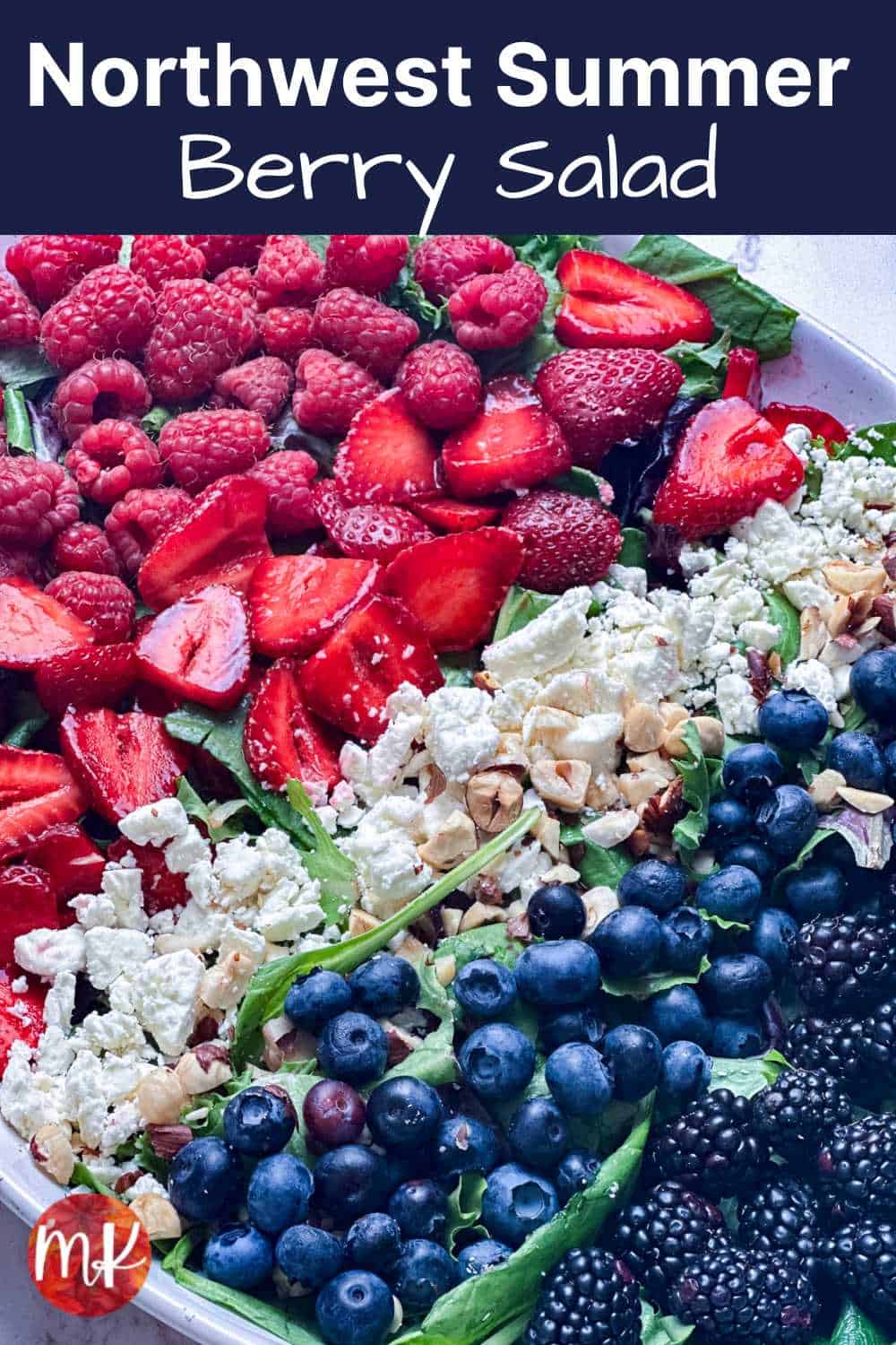 Summer berries on a bed of mixed greens with the title of the recipe at the top.