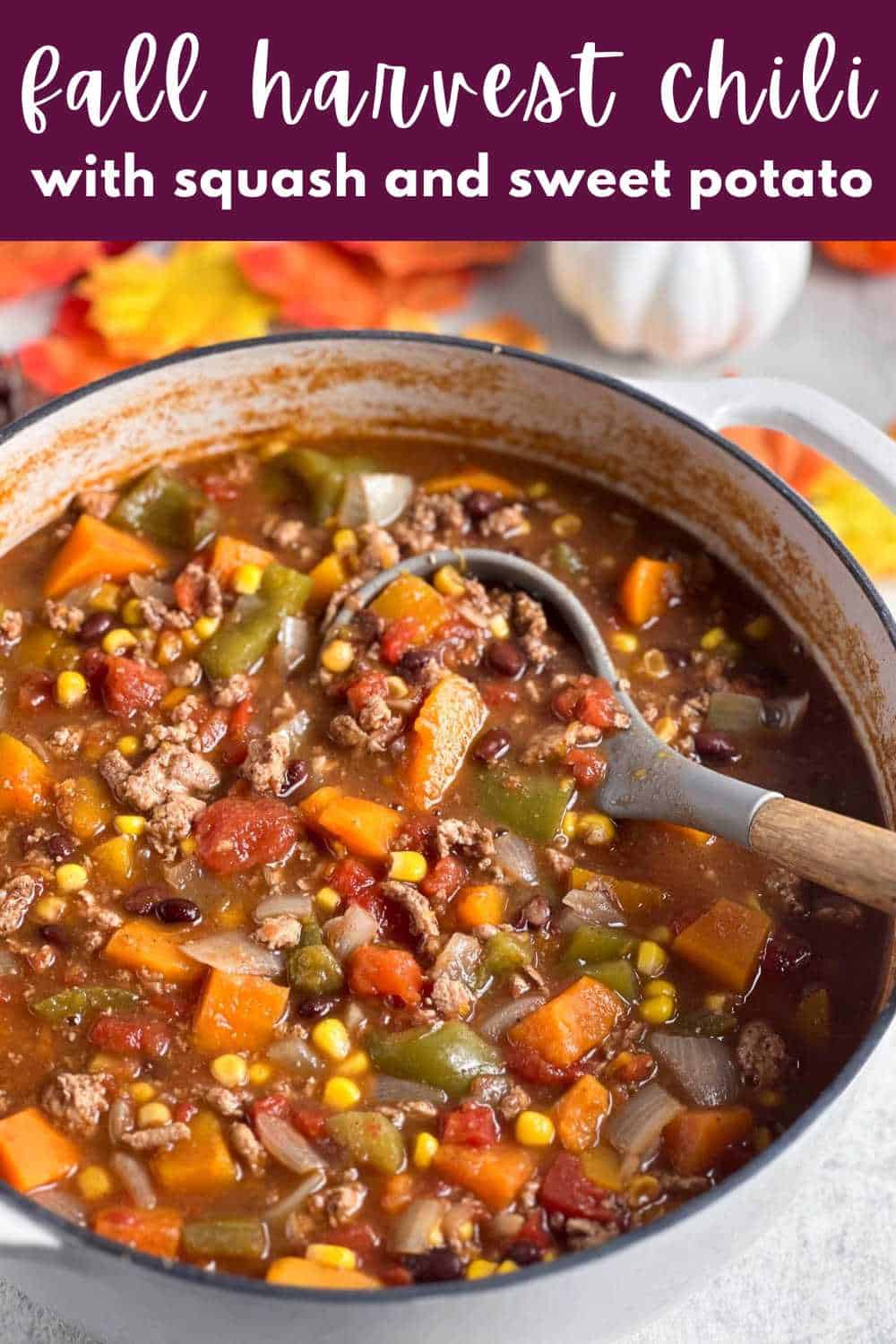 Chili with sweet potato and squash in a white pot.