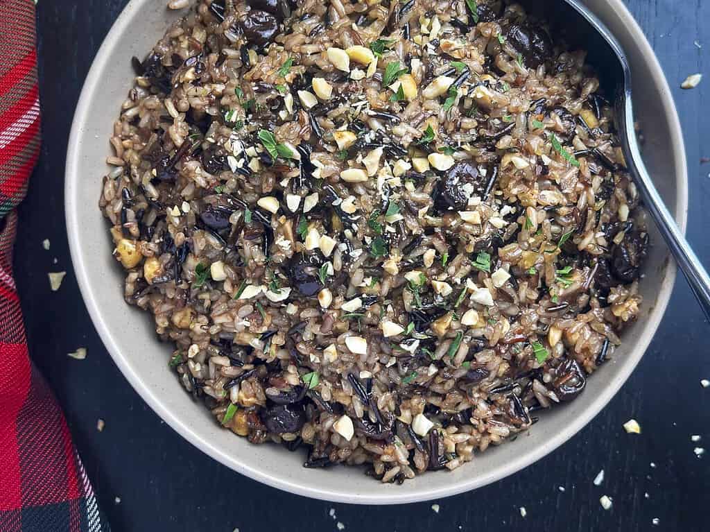 Wild rice blend in a bowl with dried cherries and hazelnuts.