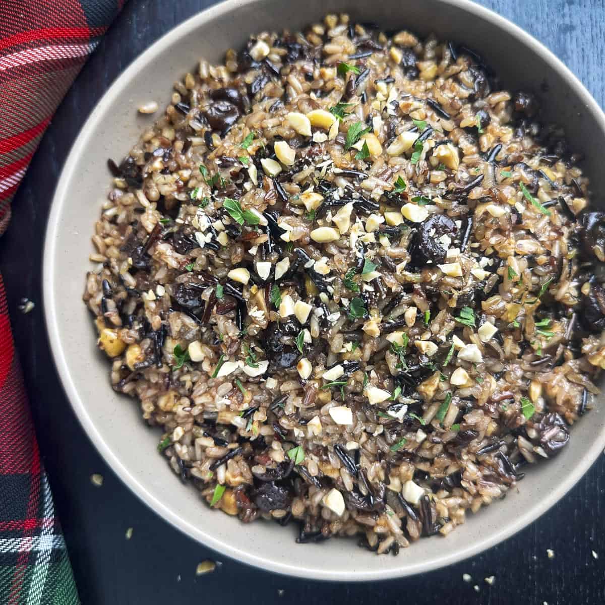Wild rice blend in a bowl with dried cherries and hazelnuts.
